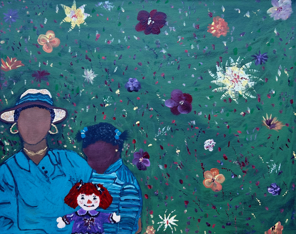 A woman with a child on her lap. The child is holding a doll.