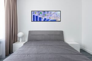 The Human Time Line painting hanging above a bed.