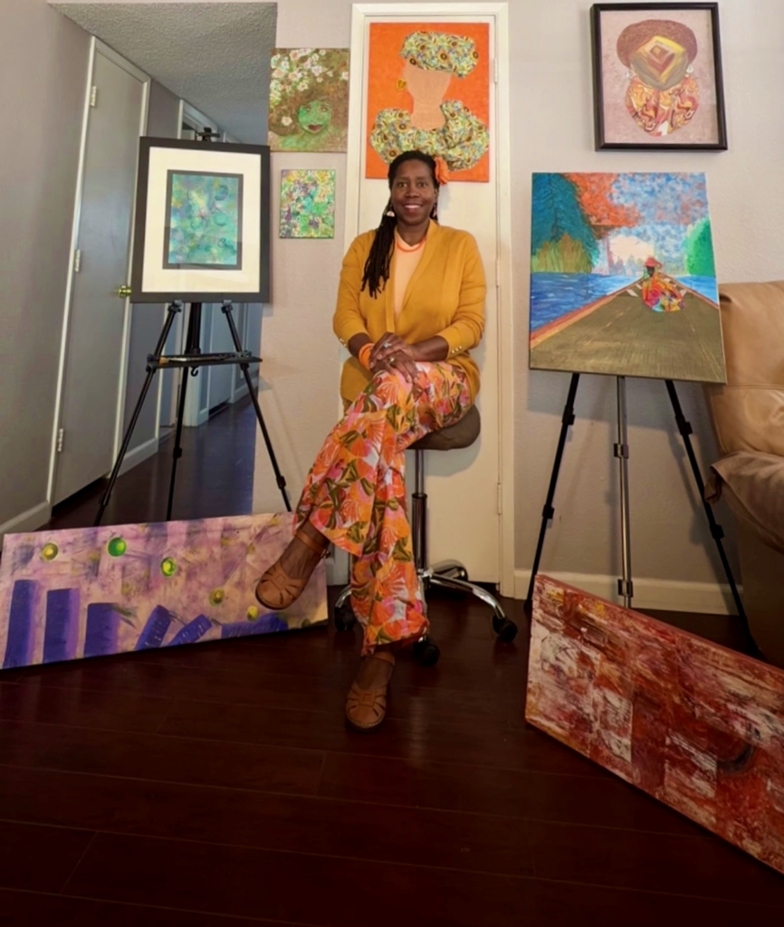 Founder picture in art studio surrounded by original art.